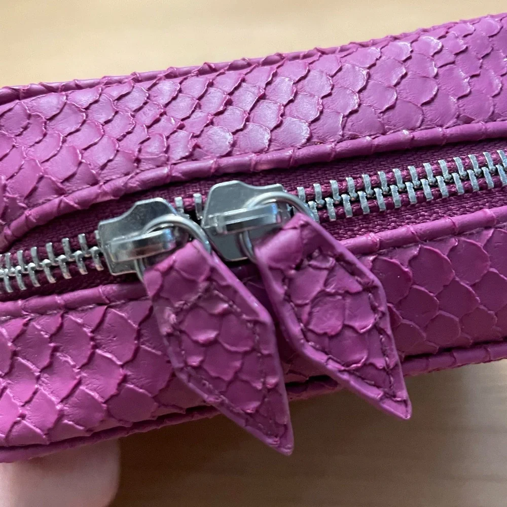 TRISH McEvoy embossed pink makeup planner